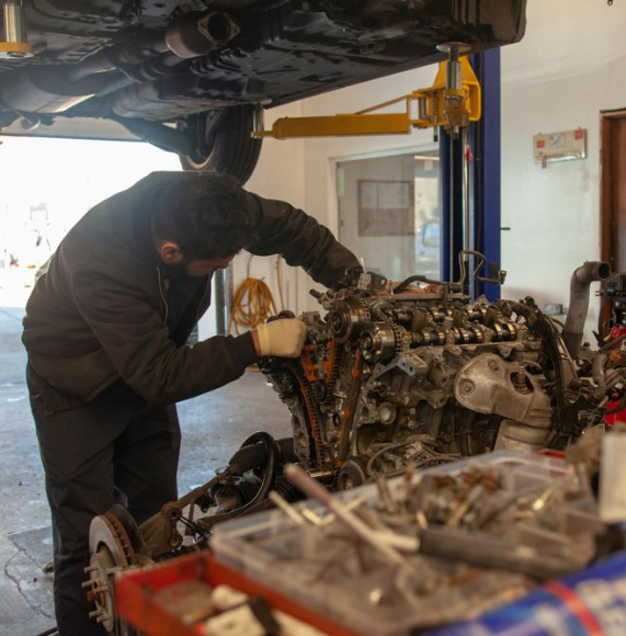 Technician working on an engine